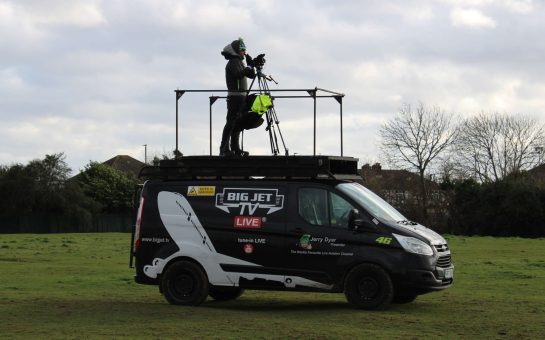 Jerry Dyer on top his transit van filming planes landing at Heathrow