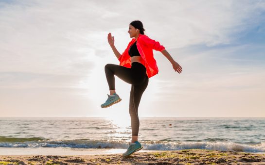 Woman exercising on a beach