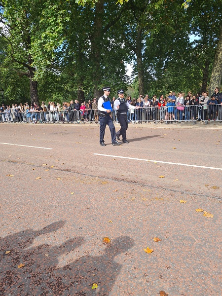 Policemen patrol the route to Hyde Park
