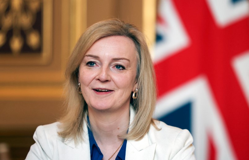 Liz Truss in front of the Union Flag