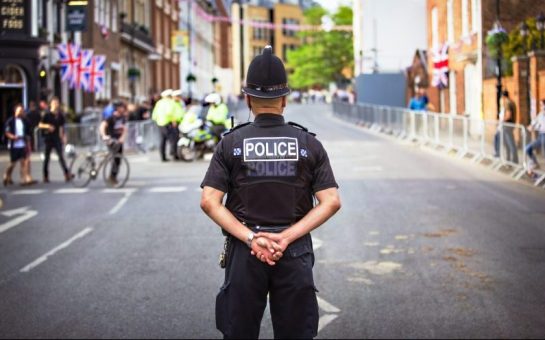 A police officer stood in a street