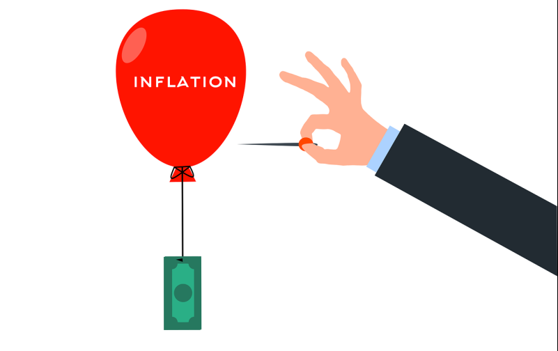 balloon being popped with inflation written on it
