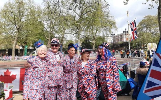 People celebrating the coronation in Union Jack suits
