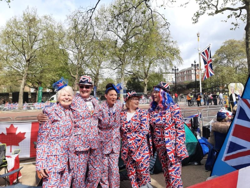 People celebrating the coronation in Union Jack suits