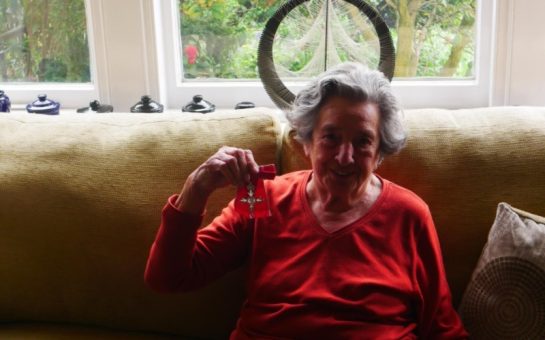 89-year-old Ella Marks holds her MBE
