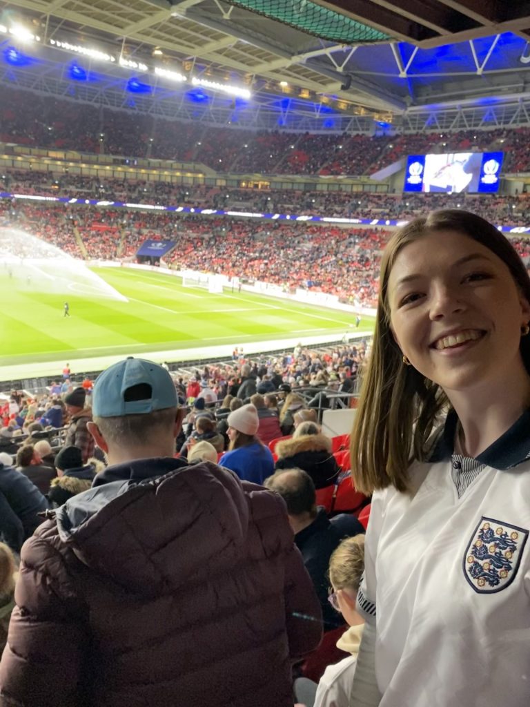 Hannah in an England top smiling as the Lionesses take on Brazil in the first ever Finalissima at Wembley.