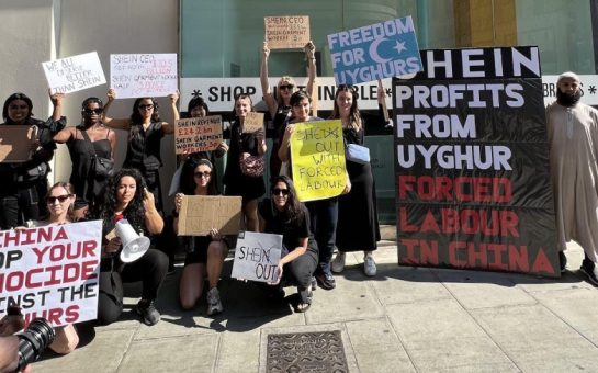 Protestors stood outside Shein's London pop up shop in Oxford street holding placards.