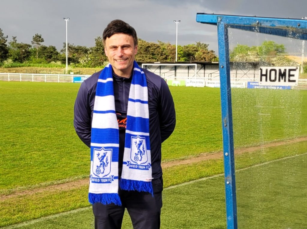 Enfield Town manager Gavin Macpherson on the day he signed for the club in May, standing by the dugout.
