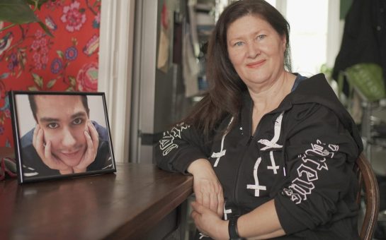 Leo Andrade sat next to a photo of her son Stephen