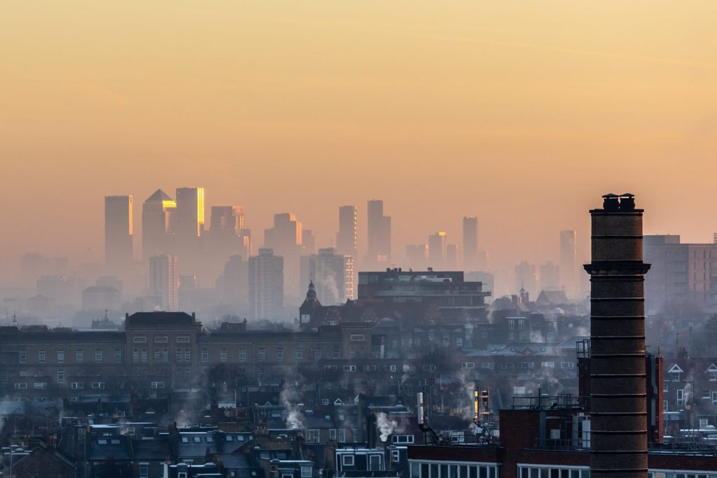 a landscape picture of London covered in a layer of smoke
