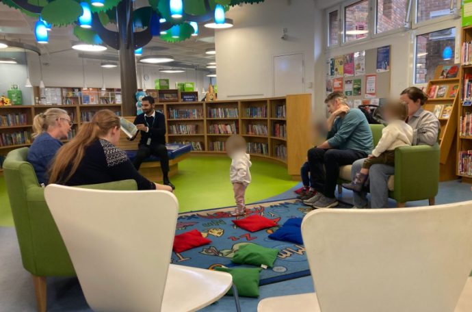 A photo of storytime to children at Uxbridge Library for International Men's Day