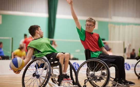 A young wheelchair basketball player prepares to shoot over another at the 2023 WheelPower National Junior Games