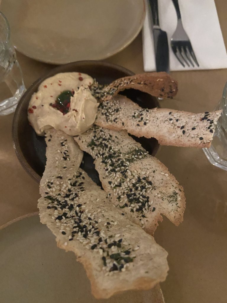 Taramasalata served with seaweeds crisp breads covered in sesame seeds 