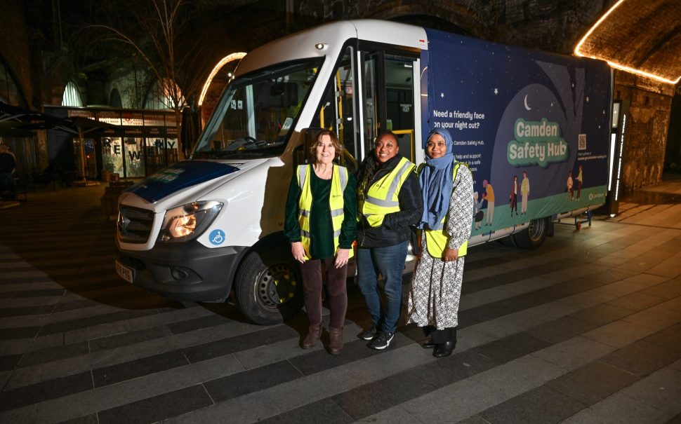 Camden Safety Hub volunteers in hi-fis jackets standing in front of Safety Hub bus