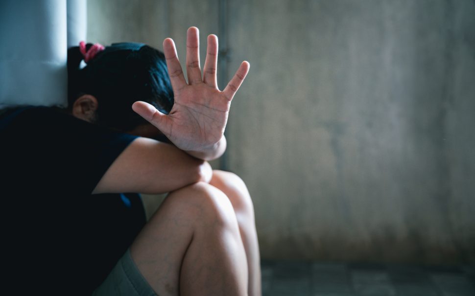 A person holding their hand up to the camera