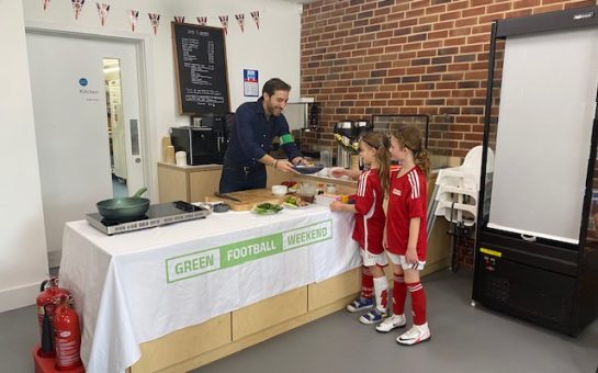 Ex-Arsenal footballer Mathieu Flamini giving a plant-based meal to two young fans