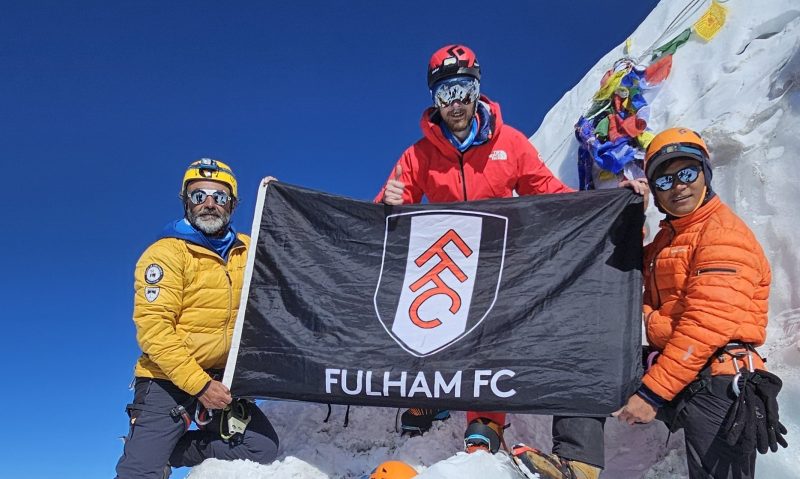 The crew with a Fulham FC banner