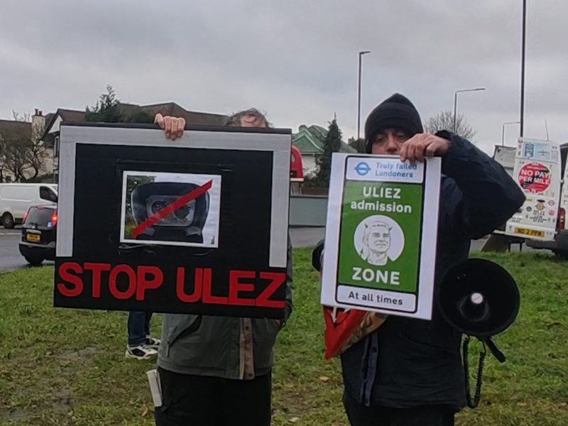 Two protestors protesting about ULEZ cameras