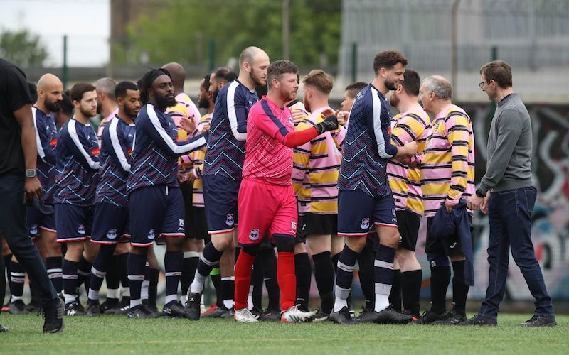 Handshakes between Piccadilly FC and Hammersmith and Circle FC in the London Underground Football League