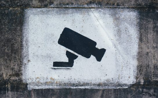 A painting on a wall warning visitors about video surveillance (Credit: Free to use from Unsplash)