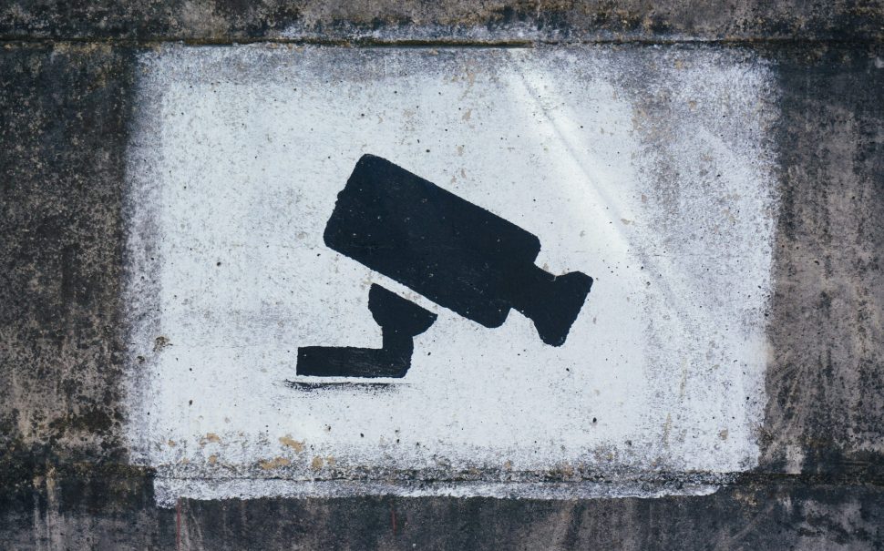 A painting on a wall warning visitors about video surveillance (Credit: Free to use from Unsplash)