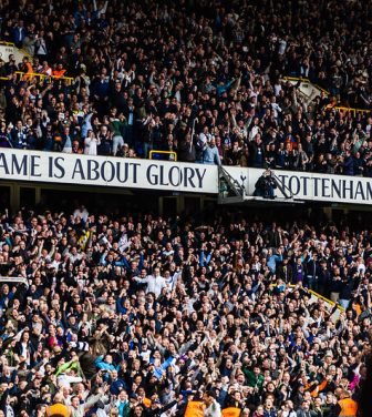Huge number of Tottenham Hotspurs supporters cheering in a stadium