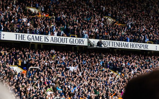 Huge number of Tottenham Hotspurs supporters cheering in a stadium