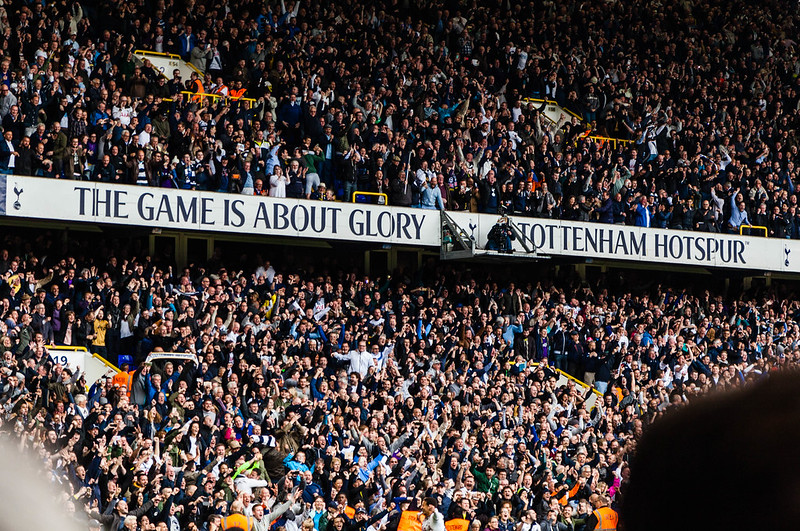 Huge number of Tottenham Hotspurs supporters cheering in a stadium