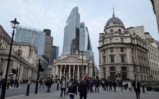 View of Lodnon's financial district, with the bank of england and hi-rise windowed towers in the background