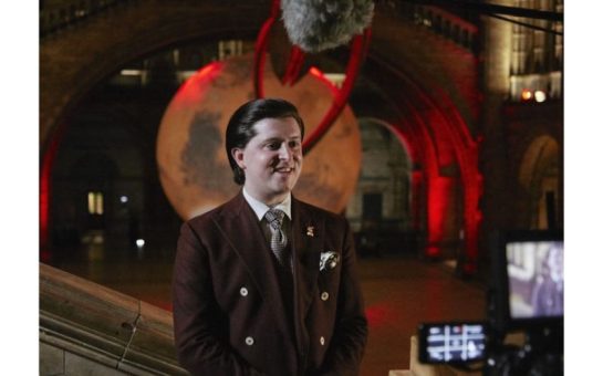 Birbeck University Professor Keyron Hickman-Lewis standing in front of the Mars exhibit at the Natural History Museum, London.