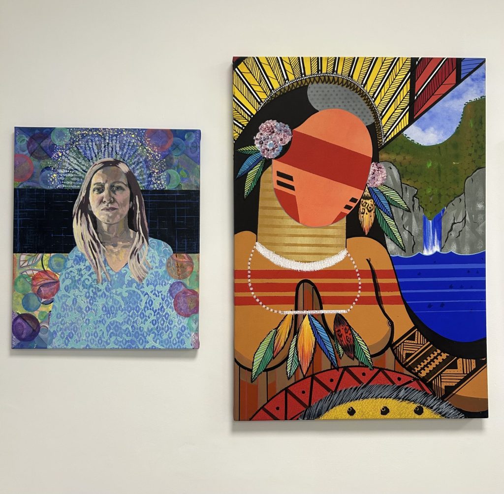 On the left, an acrylic painting of a woman in front of a colourful background by artist Tessa Gaynn entitled 'The Queen of Frigging Everything', 2025. On the right, an acrylic painting on canvas depicting an abstract Native American woman by artist Okiko entitled 'Untitled'. Displayed in Civic Action Hub, for 'From Kitchen Table to Gallery Wall' Art Exhibition. 