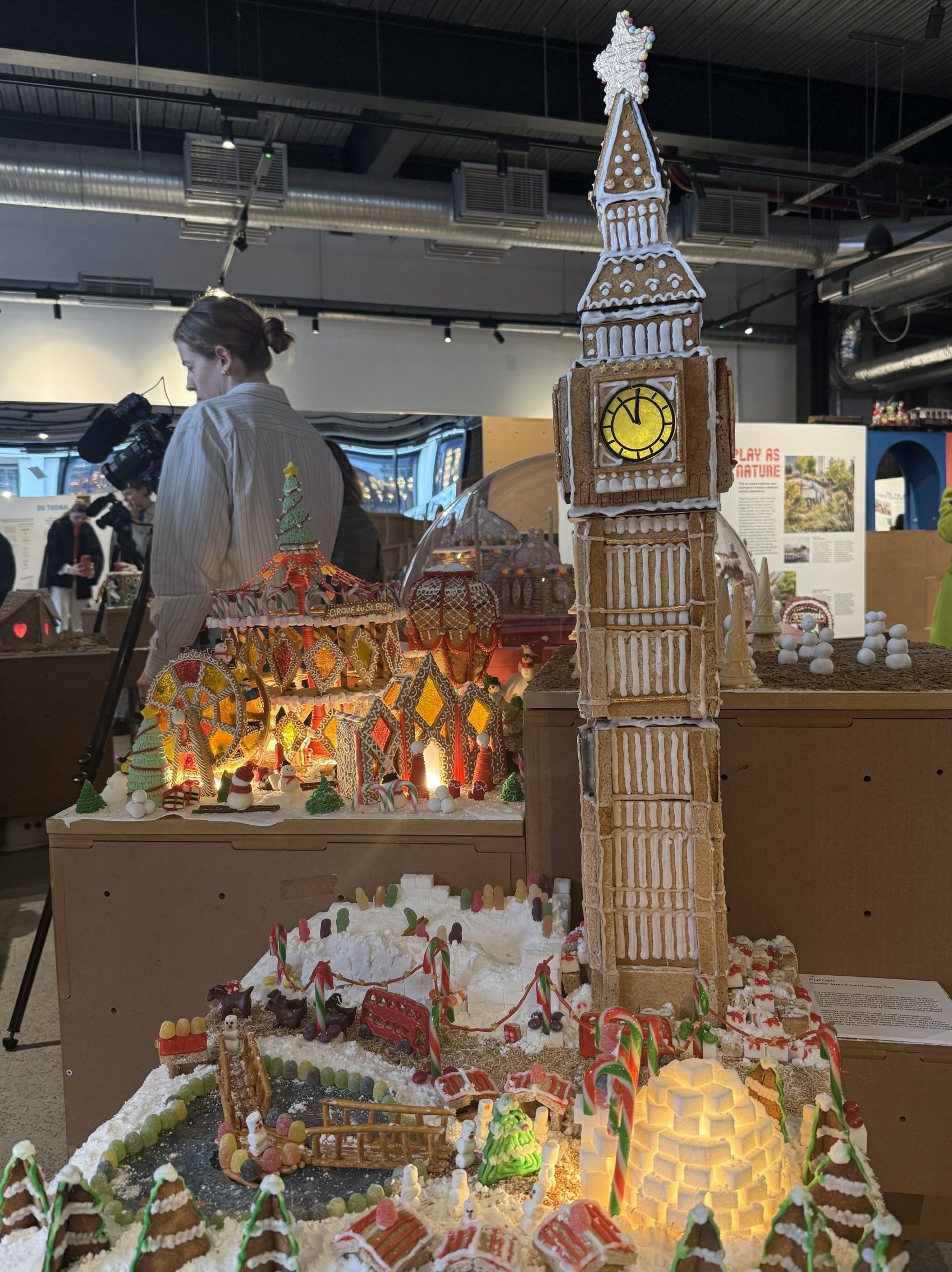 This photo is of Big Ben made out of gingerbread, surrounded by a winter landscape of what can only be described as edible London, candy canes and jelly bean people.