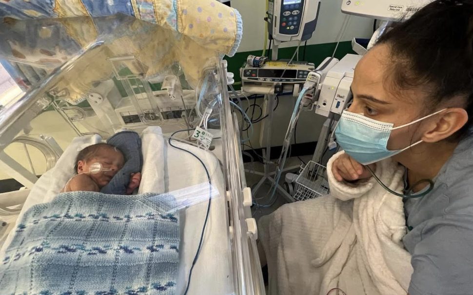 Mother, Eleasha, visits her baby