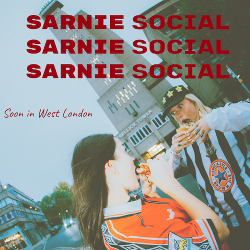 Two women eat sandwiches in the street. Red text overlay reads 'Sarnie Social' three times in capital letters, and the words 'Soon in West London' is overlaid on the left-hand side of the image, also in red.