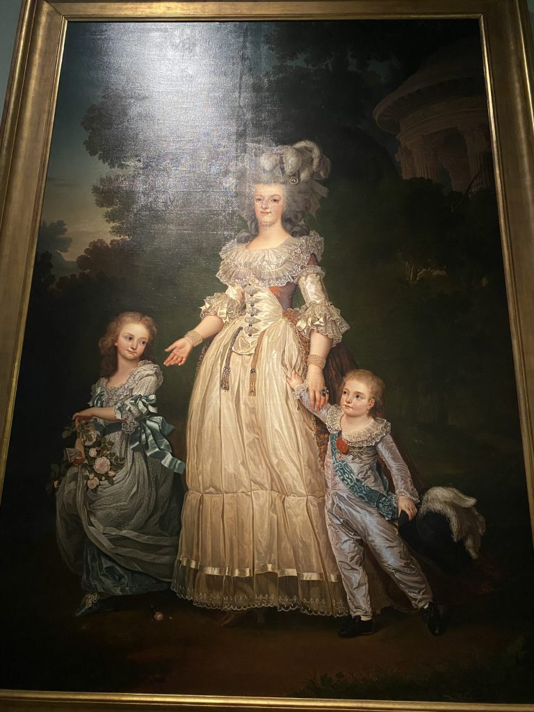 Marie Antoinette and her children walking in the Park of Trianon