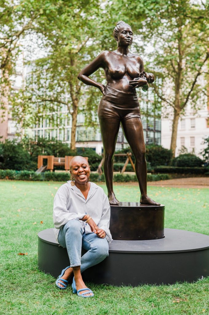British digital sculptor Rayvenn Shaleigha D’Clark with her bronze creation, Mother Vérité.  Image credit: MTArt
