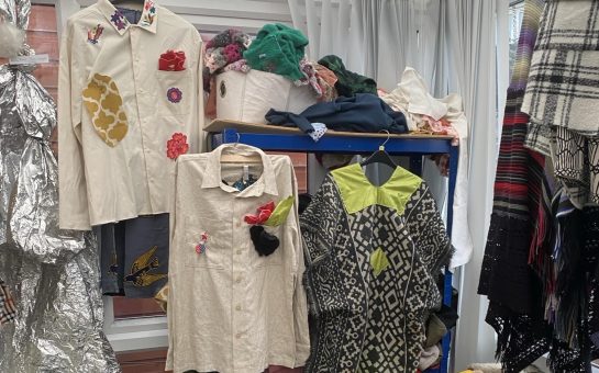 Handmade clothes hanging in a workshop