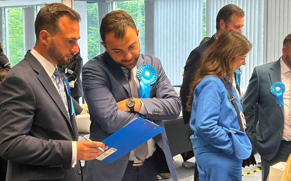 Tory and Reform candidates chat in Enfield