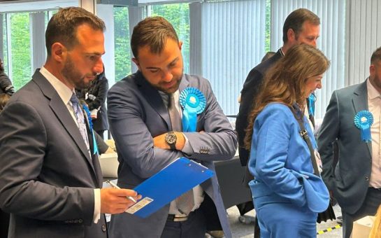 Tory and Reform candidates chat in Enfield