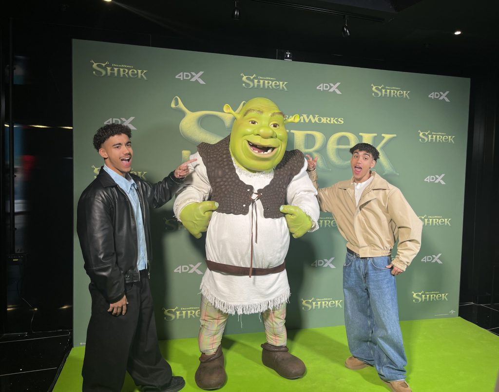 Influencers Kai and Taylor, 22, with Shrek at the influencer screening. Credit: Charlie Speed