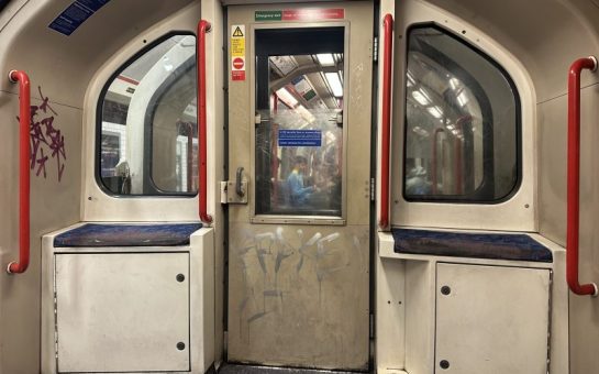 Image of the inside of a London Underground tube train on the central line.
