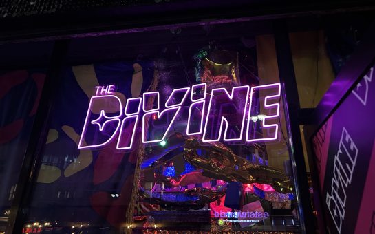 Photo of illuminated sign for The Divine venue in Dalston (Credit: Lizzie Bradley)