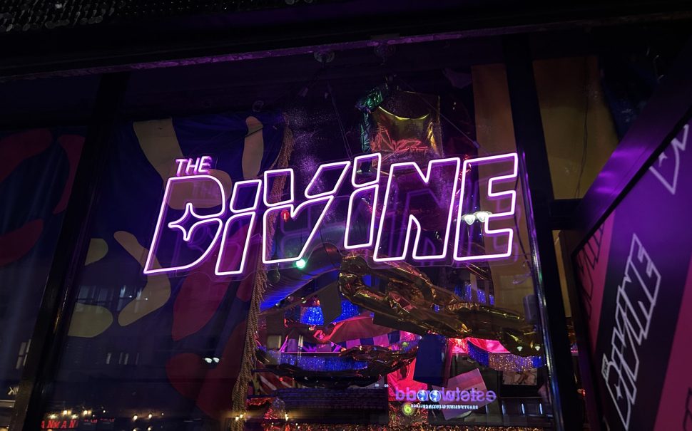 Photo of illuminated sign for The Divine venue in Dalston (Credit: Lizzie Bradley)