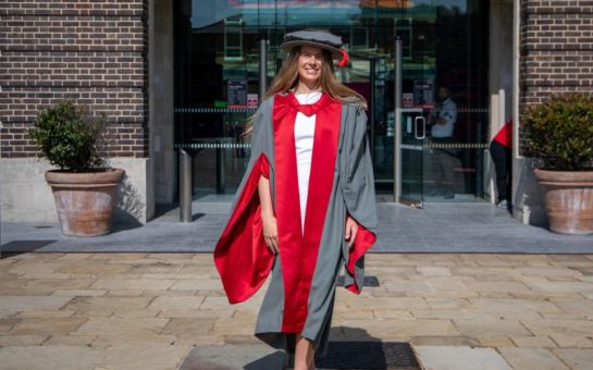A photo of Zoe Harrison in a cap and gown at Middlesex University