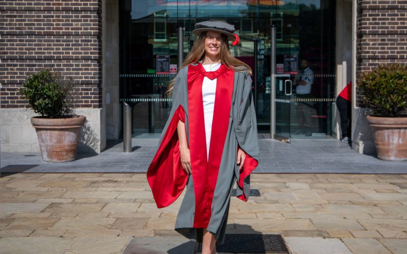 A photo of Zoe Harrison in a cap and gown at Middlesex University