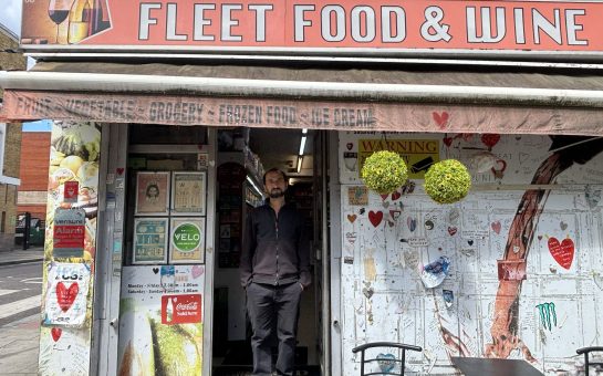 Man standing in front of corner shop