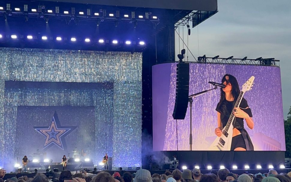 Woman playing the guitar on stage at Finsbury Park