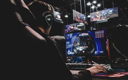 Man sitting in a chair playing games