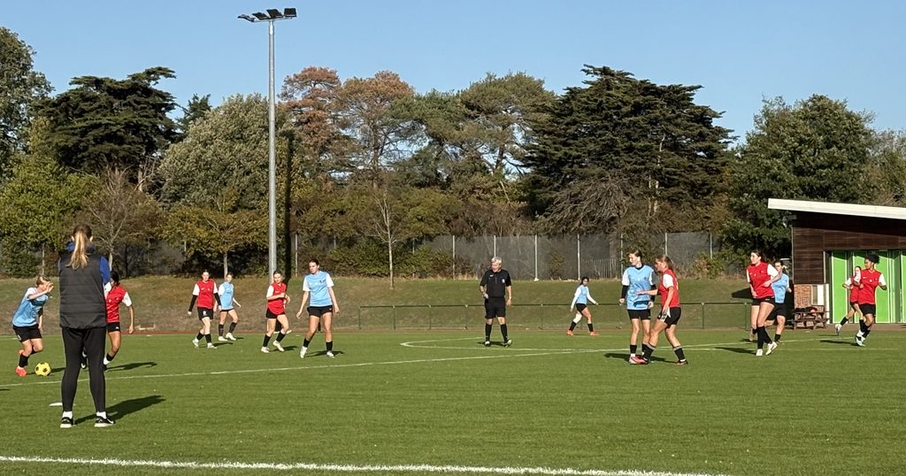 Girls playing football